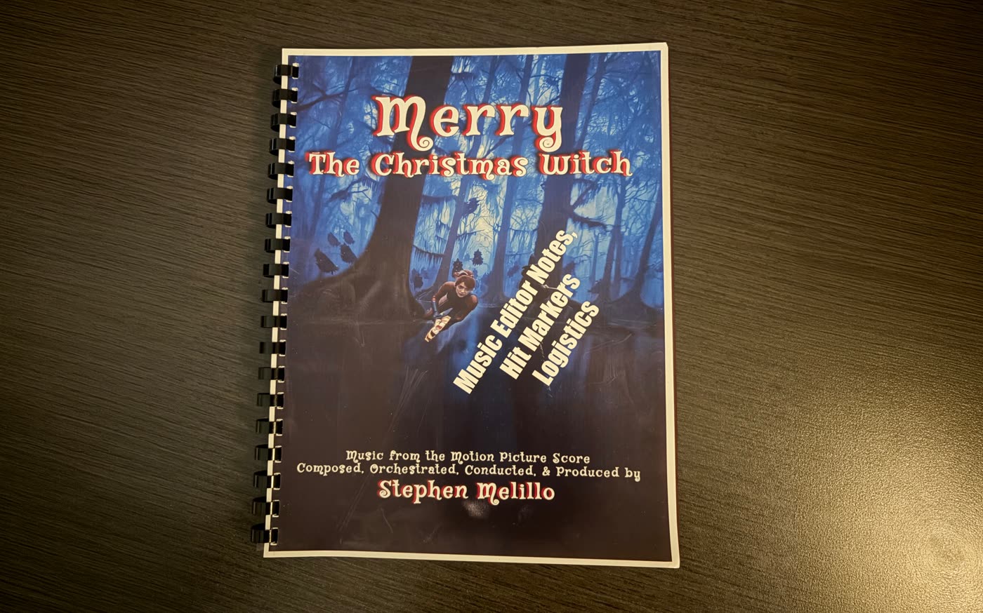Stephen Melillo's music editor notes for Merry The Christmas Witch: a bound book of hit markers, logistics and score from the motion picture.